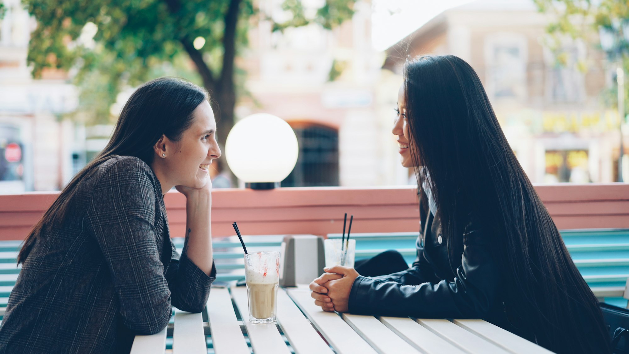 Two people talking across a table