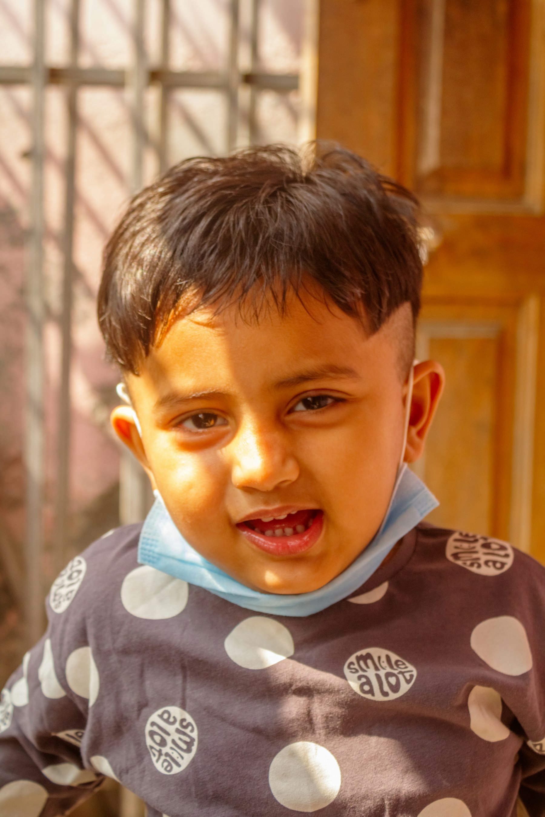 A young boy mid-sentence, unhurried